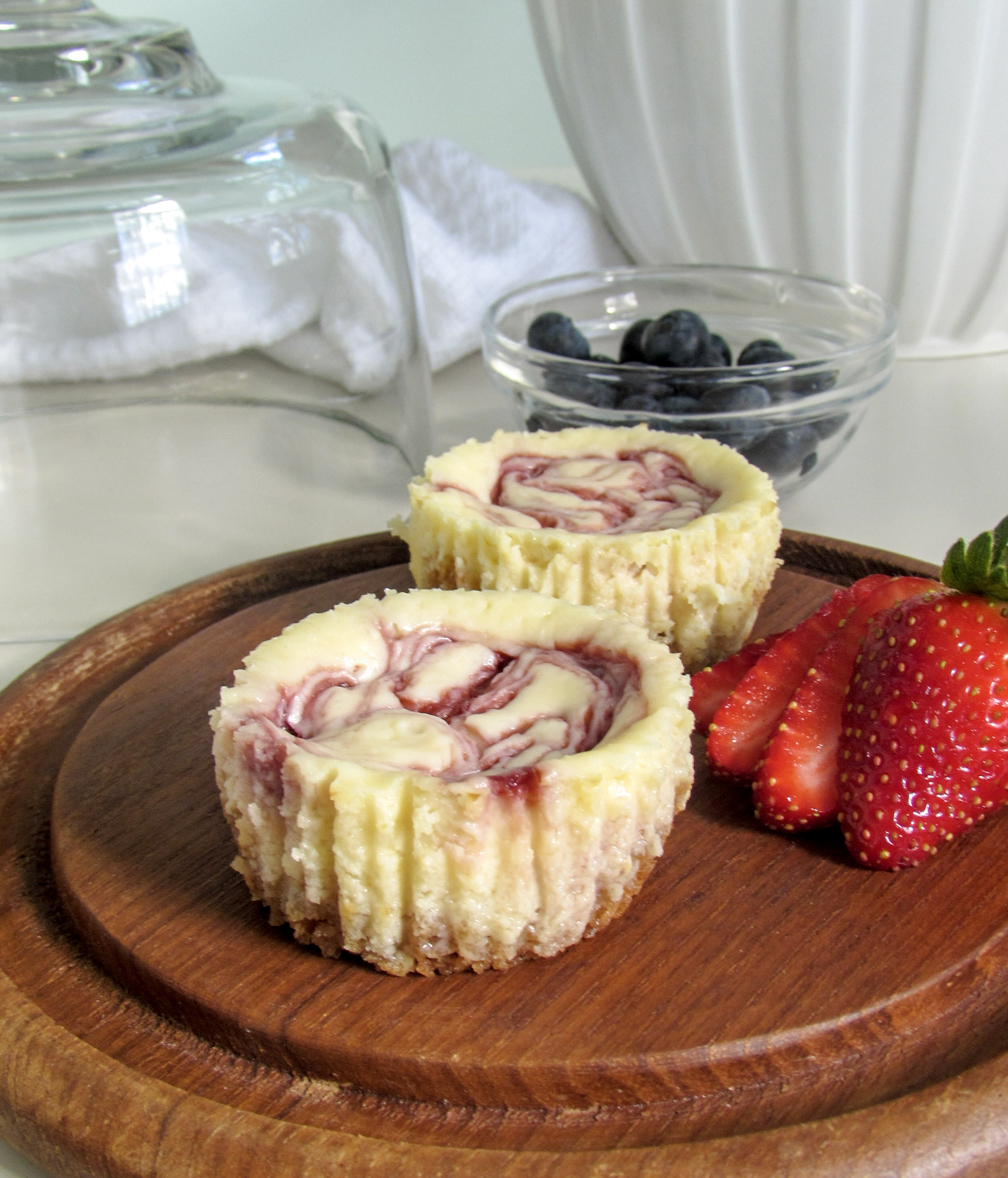 Mini White Chocolate Raspberry Swirl Cheesecakes - White Flower Lane ...